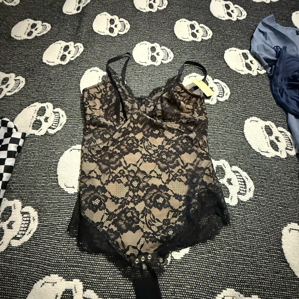 Chic Lace Bodysuit with Black Floral Design